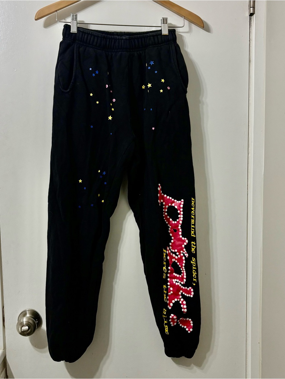 Sp5der Worldwide Sweatpants with Pink message on leg